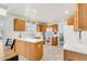 Bright kitchen with oak cabinets, white countertops, and tile floors at 793 S 22Nd Ave, Brighton, CO 80601