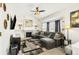 Spacious living room with L-shaped sectional sofa and fireplace at 793 S 22Nd Ave, Brighton, CO 80601