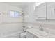 Clean bathroom with a bathtub, shower, and updated vanity at 9868 Appletree Pl, Thornton, CO 80260
