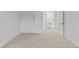 Carpeted bedroom with double door closet and view of another room at 9868 Appletree Pl, Thornton, CO 80260