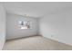 Simple carpeted bedroom with a window offering natural light at 9868 Appletree Pl, Thornton, CO 80260