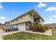 Multi-unit building with attached garages and well-maintained landscaping at 9868 Appletree Pl, Thornton, CO 80260