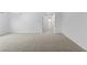 Carpeted hallway with neutral walls and doors leading to other rooms at 9868 Appletree Pl, Thornton, CO 80260