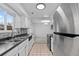 Bright kitchen features stainless steel appliances and a tile backsplash at 9868 Appletree Pl, Thornton, CO 80260