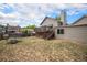 Backyard with deck, grass and a house at 12632 James Ct, Broomfield, CO 80020