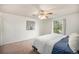 Bedroom with a ceiling fan and a white comforter on the bed at 12632 James Ct, Broomfield, CO 80020
