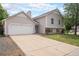 Charming two-story home with a spacious driveway and a well-maintained front yard at 12632 James Ct, Broomfield, CO 80020