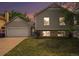 Charming home with a two car garage, manicured lawn, brick accents, and updated windows at 12632 James Ct, Broomfield, CO 80020