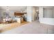 Open layout blending kitchen and dining areas featuring wood cabinets and lots of light at 12632 James Ct, Broomfield, CO 80020