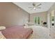 Large bedroom featuring a balcony, carpeted floors, and neutral colors at 7140 Simms St # 102, Arvada, CO 80004