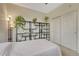 This bedroom features a large shelving unit and a comfortable bed, perfect for relaxation at 7140 Simms St # 102, Arvada, CO 80004