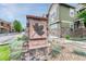 Attractive stone sign with a maple leaf identifies the Maple Leaf community and its charming exteriors at 7140 Simms St # 102, Arvada, CO 80004