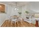 Dining area with modern lighting, a round table, and comfortable seating for four at 7140 Simms St # 102, Arvada, CO 80004