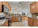 Bright, open kitchen with stainless steel appliances and a view of the living room at 7140 Simms St # 102, Arvada, CO 80004