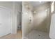 Modern bathroom featuring a walk-in shower with glass door and tiled walls at 5101 Quitman St, Denver, CO 80212