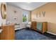 Cozy Bedroom with rocking chair, crib, and warm, inviting decor at 5101 Quitman St, Denver, CO 80212