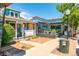 The exterior features a charming building with a vibrant turquoise facade and brick accent and a welcoming front porch at 5101 Quitman St, Denver, CO 80212