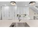 Modern kitchen with white cabinets, stainless steel appliances, and ample counter space at 5101 Quitman St, Denver, CO 80212