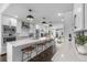 Spacious kitchen with modern appliances, a large island, and an open view to the living room at 5101 Quitman St, Denver, CO 80212