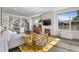 Bright living room featuring a fireplace, stylish decor, and open layout into the modern kitchen at 5101 Quitman St, Denver, CO 80212