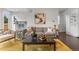 Cozy living room featuring stylish decor, a comfortable sofa, and ample seating at 5101 Quitman St, Denver, CO 80212