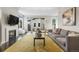 Bright and open living room with a fireplace, sliding doors to the backyard, and stylish furniture at 5101 Quitman St, Denver, CO 80212