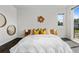 Comfortable main bedroom featuring a unique headboard, side tables, and stylish decor at 5101 Quitman St, Denver, CO 80212