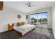 Bright and airy main bedroom featuring a large window and comfortable furnishings at 5101 Quitman St, Denver, CO 80212