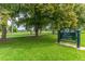Picturesque Rocky Mountain Lake Park, a serene green space with walking paths and lush trees at 5101 Quitman St, Denver, CO 80212