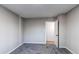 Simple bedroom with carpet, neutral walls, and an open doorway at 795 Troy Ct, Aurora, CO 80011