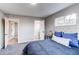 Carpeted bedroom features an open doorway to the bathroom and closet at 795 Troy Ct, Aurora, CO 80011