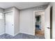 Well-lit bedroom featuring soft carpet, closet and an open doorway at 795 Troy Ct, Aurora, CO 80011