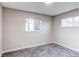 Empty bedroom with neutral decor, soft carpet and bright natural light at 795 Troy Ct, Aurora, CO 80011