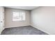 Neutral bedroom design with a window, soft carpet and clean lines at 795 Troy Ct, Aurora, CO 80011