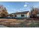 Attractive one-story home featuring a well-maintained lawn and mature trees at 795 Troy Ct, Aurora, CO 80011