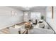 Cozy living room featuring a plush sofa, area rug, and contemporary accents at 795 Troy Ct, Aurora, CO 80011