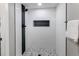 Modern walk-in shower with white tiles and sleek fixtures at 795 Troy Ct, Aurora, CO 80011