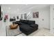Spacious finished basement with a comfortable sectional sofa, modern bar, and stylish decor at 3709 Tejon St, Denver, CO 80211