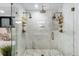 Luxurious bathroom shower with dual shower heads, marble walls, and stylish bronze fixtures, creating an spa-like experience at 3709 Tejon St, Denver, CO 80211