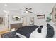 Bright and airy bedroom featuring a large bed, modern furnishings, and hardwood floors for a serene retreat at 3709 Tejon St, Denver, CO 80211