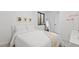 Comfortable bedroom with a cozy bed, stylish decor, and a large mirror, creating a bright and airy space at 3709 Tejon St, Denver, CO 80211