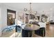 Elegant dining room with modern light fixture, modern decor, and hardwood floors at 3709 Tejon St, Denver, CO 80211