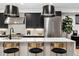 Sleek kitchen with marble countertops, stainless steel appliances, and custom cabinetry at 3709 Tejon St, Denver, CO 80211