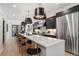 Modern kitchen with white countertops, stainless steel appliances, and ample seating at 3709 Tejon St, Denver, CO 80211