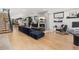 Open-concept living room featuring hardwood floors, fireplace, and modern decor at 3709 Tejon St, Denver, CO 80211