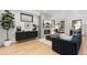 Bright and airy living room with fireplace, modern decor, and hardwood floors at 3709 Tejon St, Denver, CO 80211