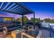 A contemporary rooftop deck featuring modern outdoor furniture and pergola at 3709 Tejon St, Denver, CO 80211