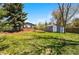 Large backyard featuring a storage shed, perfect for outdoor equipment, and a lush green lawn for recreation at 7413 S Tamarac St, Centennial, CO 80112