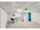 Finished basement with a seating area and a desk, perfect for a home office or study space at 7413 S Tamarac St, Centennial, CO 80112