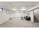 Finished basement with a decorative ceiling, carpet, and a cozy seating area offers great extra space at 7413 S Tamarac St, Centennial, CO 80112